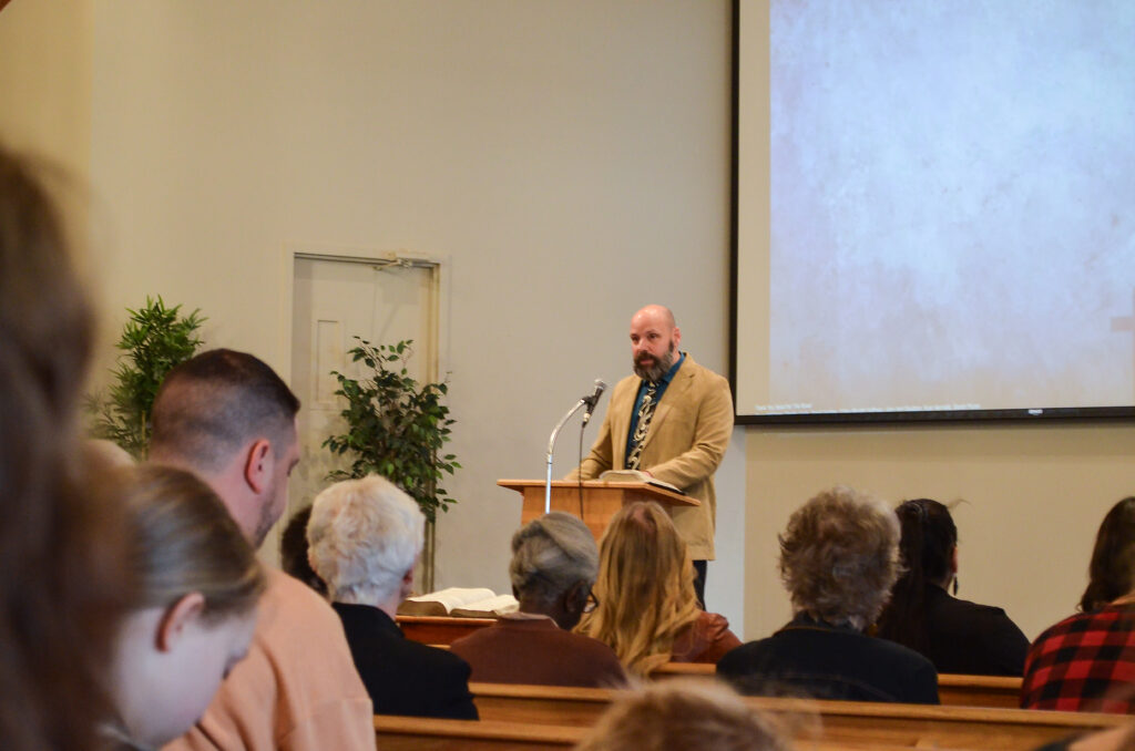 Photo of an NLSC church service. Pastor John teaching.